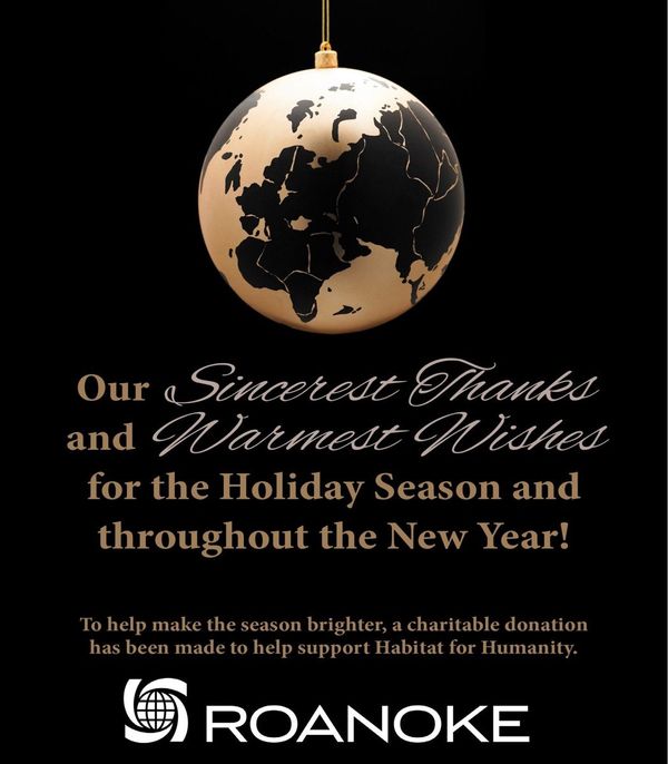 Gold and black ornament with a world map design alongside holiday wishes and a Roanoke logo