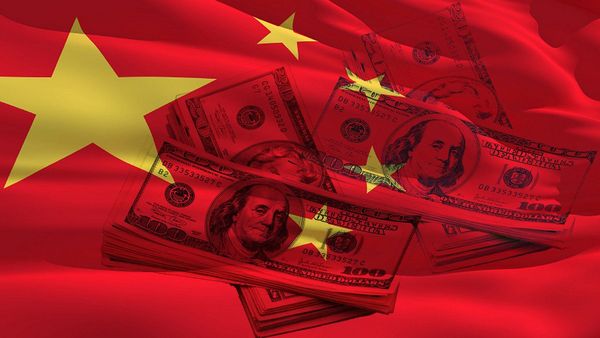 $100 bills draped over a waving red and yellow Chinese flag, symbolizing economic relations and financial interplay