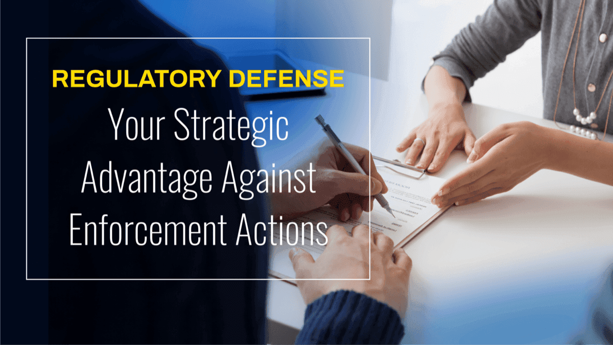 Hands signing document with "Regulatory Defense: Your Strategic Advantage Against Enforcement Actions" text