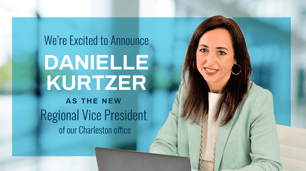 A smiling professional woman in a mint green blazer announces her promotion to Regional Vice President
