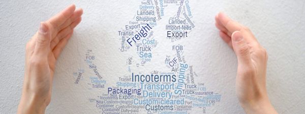Hands frame a word cloud highlighting international trade terms like Incoterms, shipping, export, customs