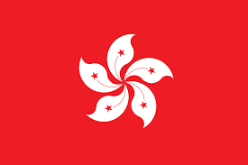 Red flag with a white stylized flower-like emblem composed of six curved petals with black and white stars